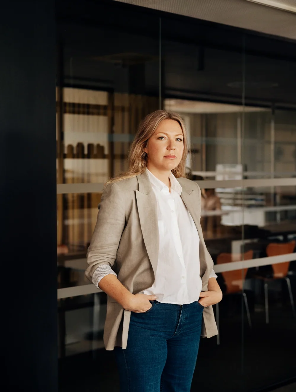 Team member portrait in beige blazer
