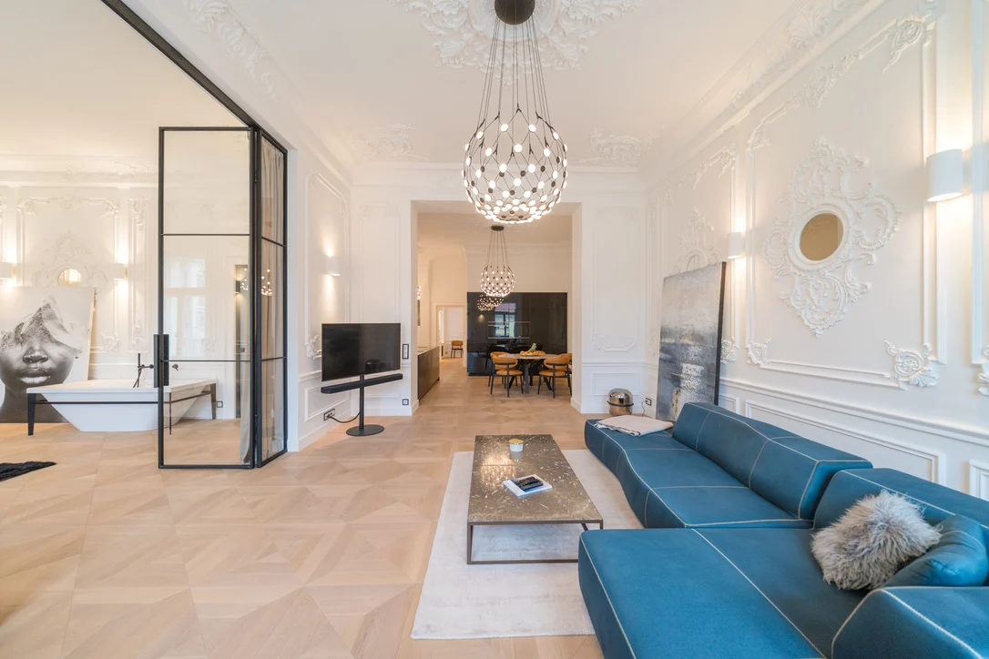 Bright living room with stucco ceiling in a renovated downtown apartment